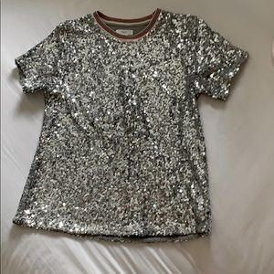 A silver sequenced shirt